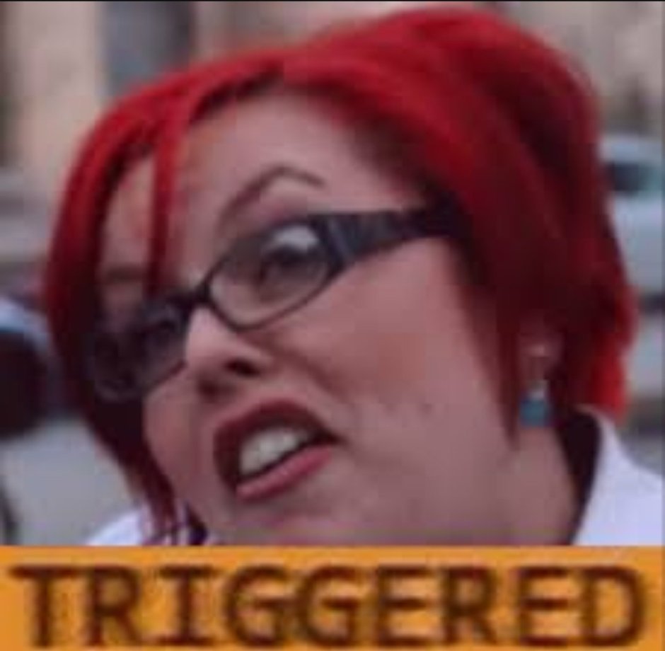 Феминистка с красными волосами Triggered